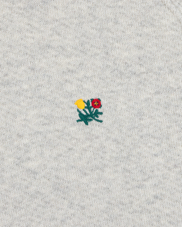 Colorblock Crest Snap Hoodie with a small yellow and red flower patch on gray heathered fabric.