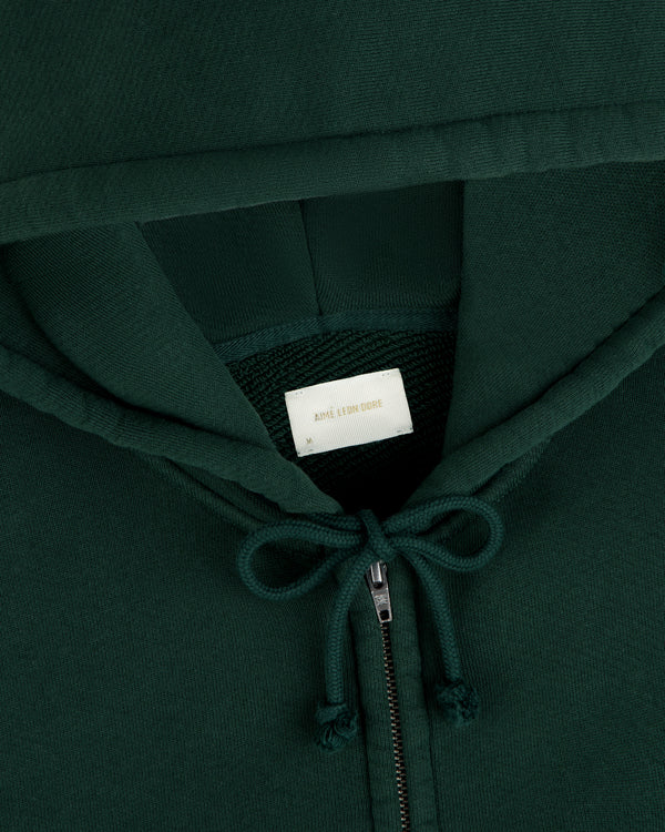 Dark green Script Full Zip Hoodie with a drawstring hood and a brand label at the neckline.