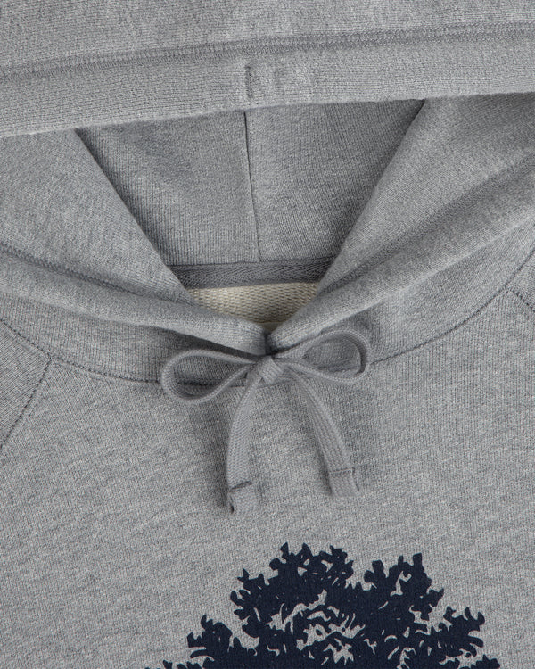Olive Tree Hoodie: grey hooded sweatshirt with a dark green tree graphic and tied drawstring hood.