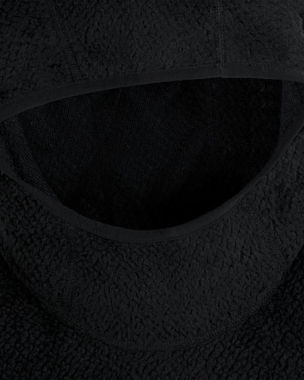 Close-up of a black textured Fleece Performance Hoodie hood with smooth fabric trim.