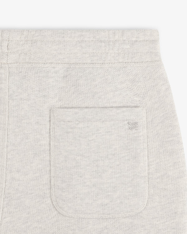 Close-up of the back pocket on Stone Washed Marina Sweatpants with a subtle embroidered logo above the pocket.