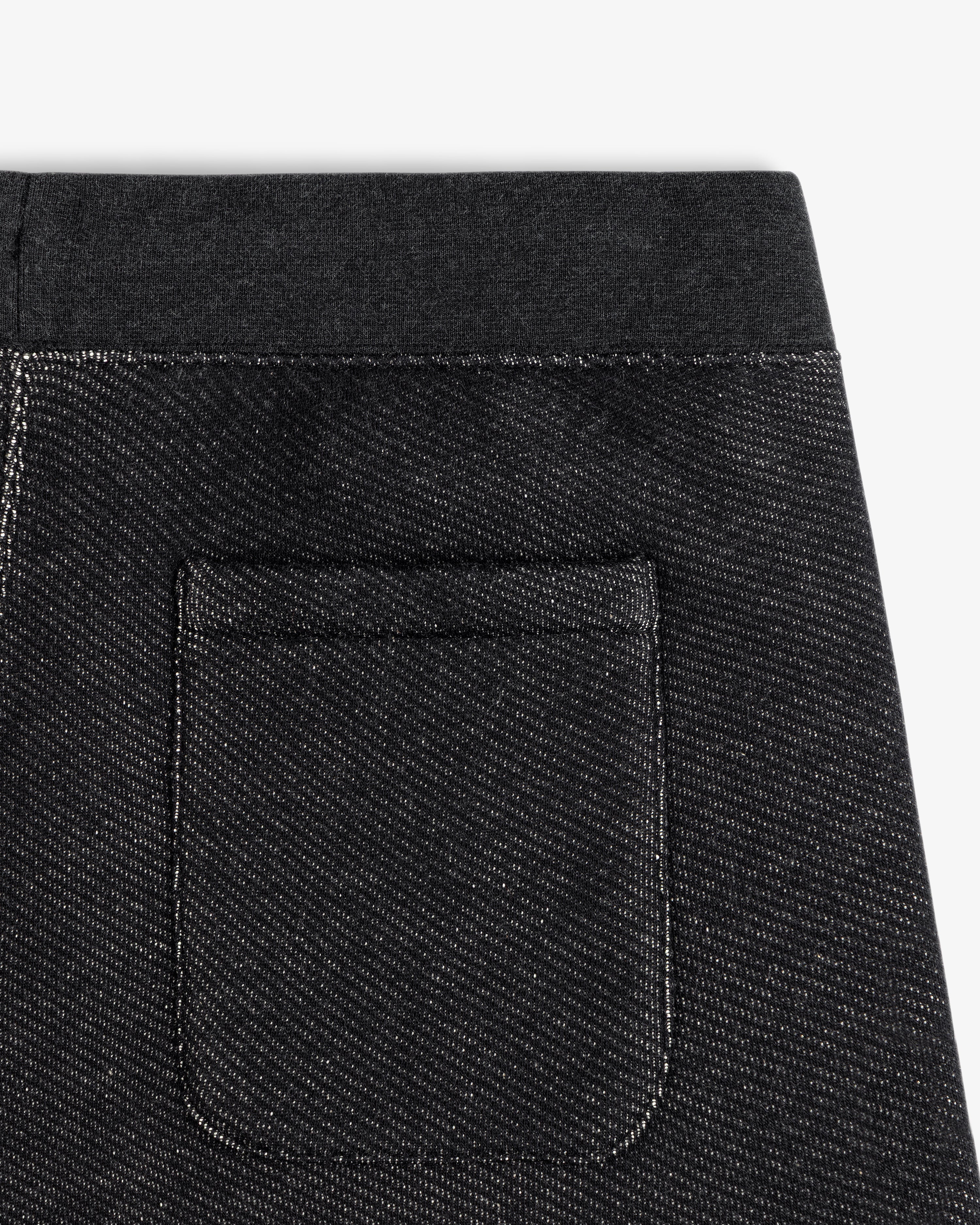Close-up of the charcoal gray Terry Lounge Sweatpant back pocket with an elastic waistband.