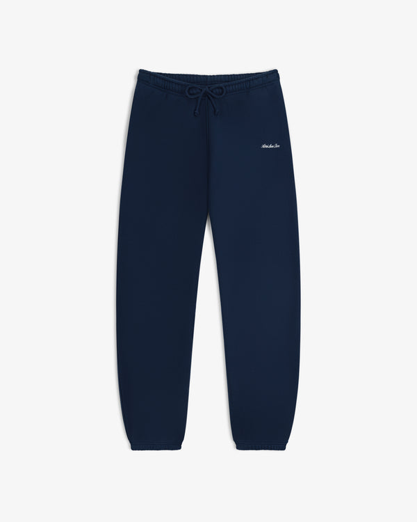 Script Sweatpant in navy blue with a drawstring waist and small white script embroidery on the hip.