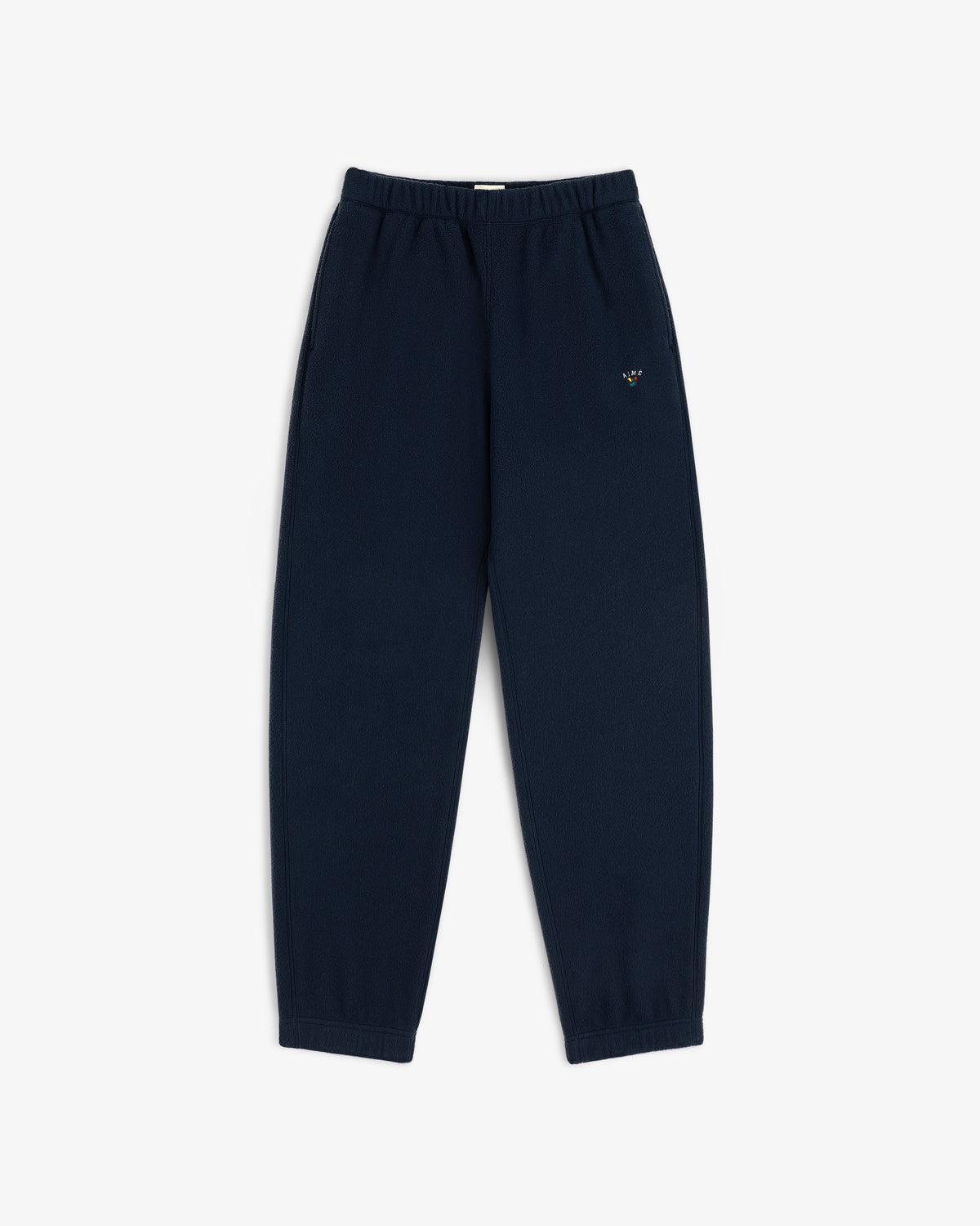 Crest Fleece Sweatpant in navy, elastic waist/cuffs, small logo on left thigh, displayed flat on white background.