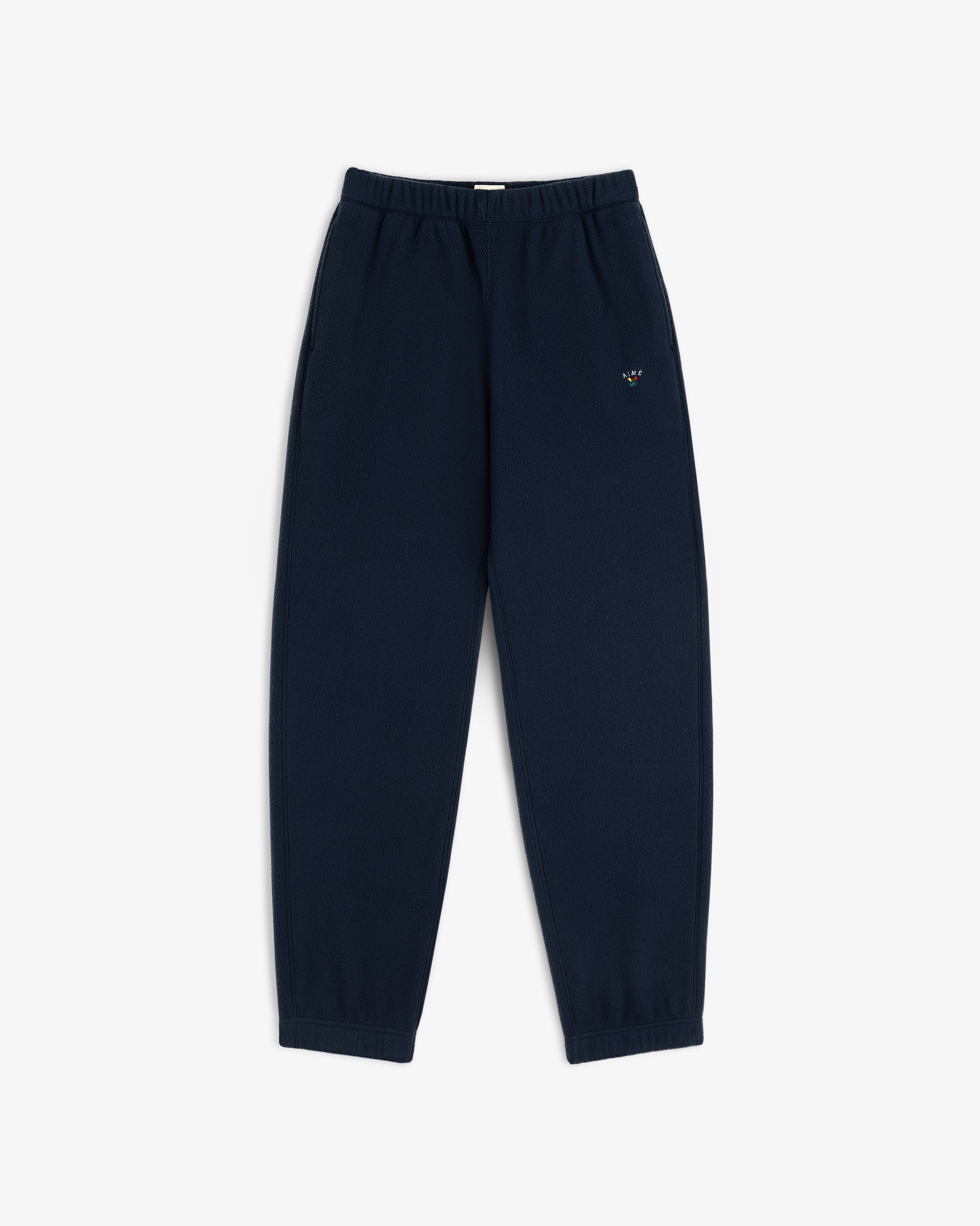 Crest Fleece Sweatpant in navy, elastic waist/cuffs, small logo on left thigh, displayed flat on white background.