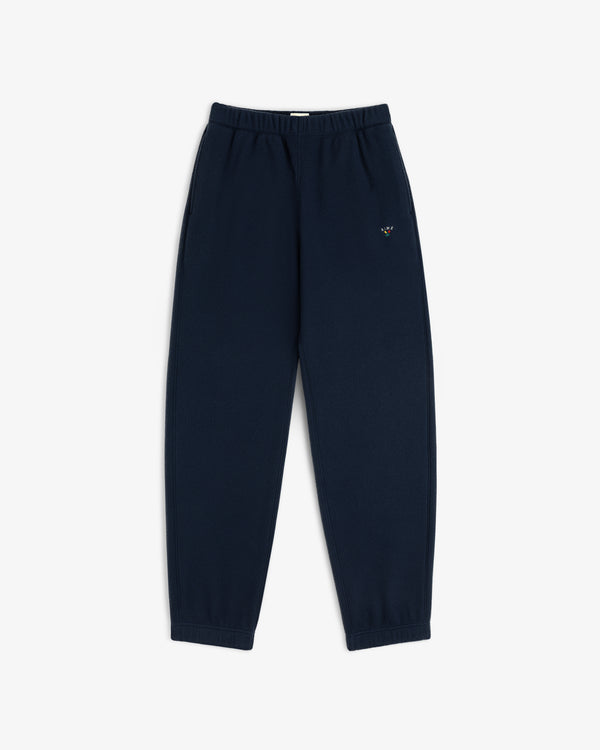 Crest Fleece Sweatpant in navy, elastic waist/cuffs, small logo on left thigh, displayed flat on white background.