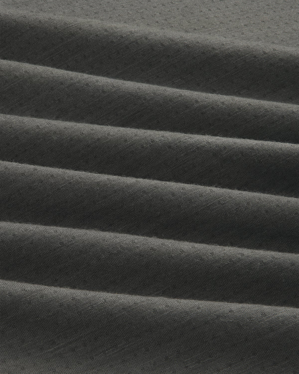 Dark gray ALD/The North Face DOTKNIT™ Wool Quarter Zip with subtle textured fabric in horizontal pleats.