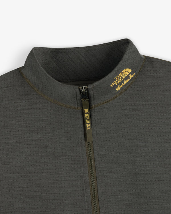 Close-up of the ALD / The North Face DOTKNIT™ Wool Quarter Zip in dark gray, logos by the collar visible.