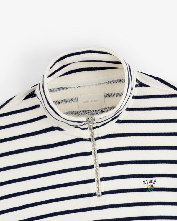 Striped Crest Quarter Zip: navy/white stripes, quarter zip, chest flower & small embroidered AIME logo.