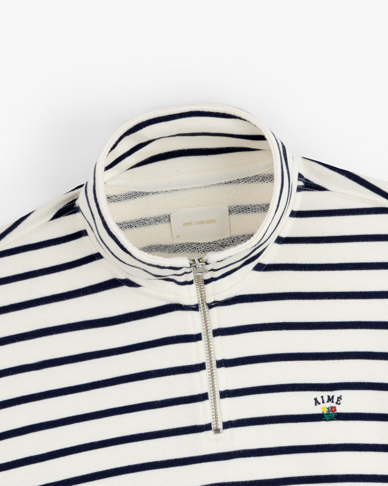 Striped Crest Quarter Zip: navy/white stripes, quarter zip, chest flower & small embroidered AIME logo.