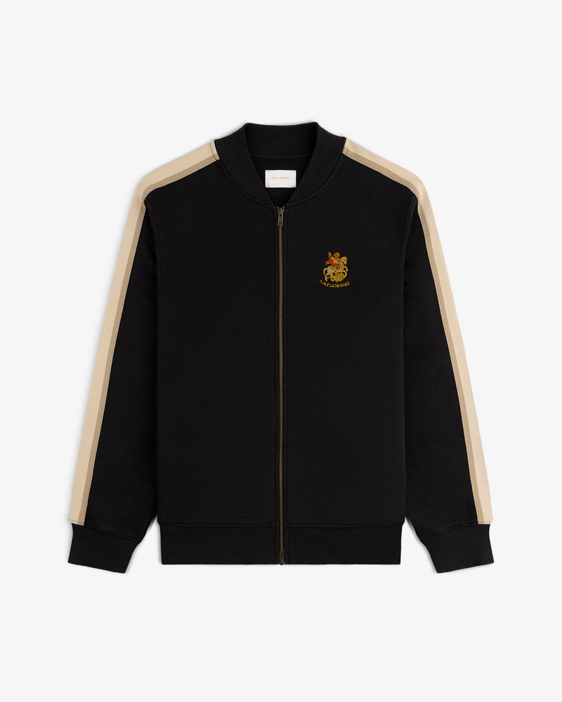 Saint George Track Jacket: black zip-up with beige sleeve stripes and an embroidered crest on the left chest.