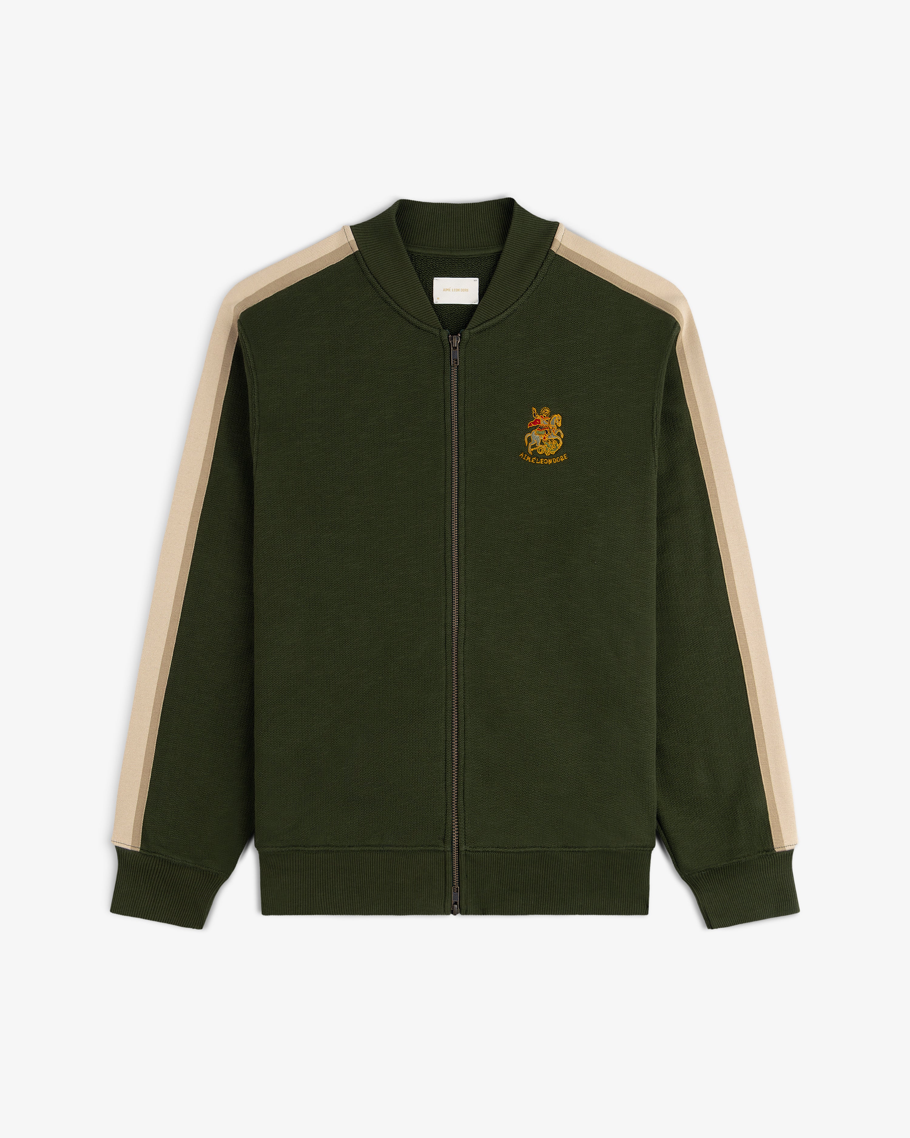 Saint George Track Jacket—dark green zip-up with beige sleeve stripes and crest on left chest.