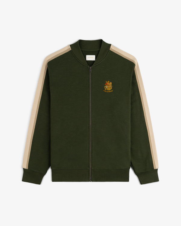 Saint George Track Jacket—dark green zip-up with beige sleeve stripes and crest on left chest.
