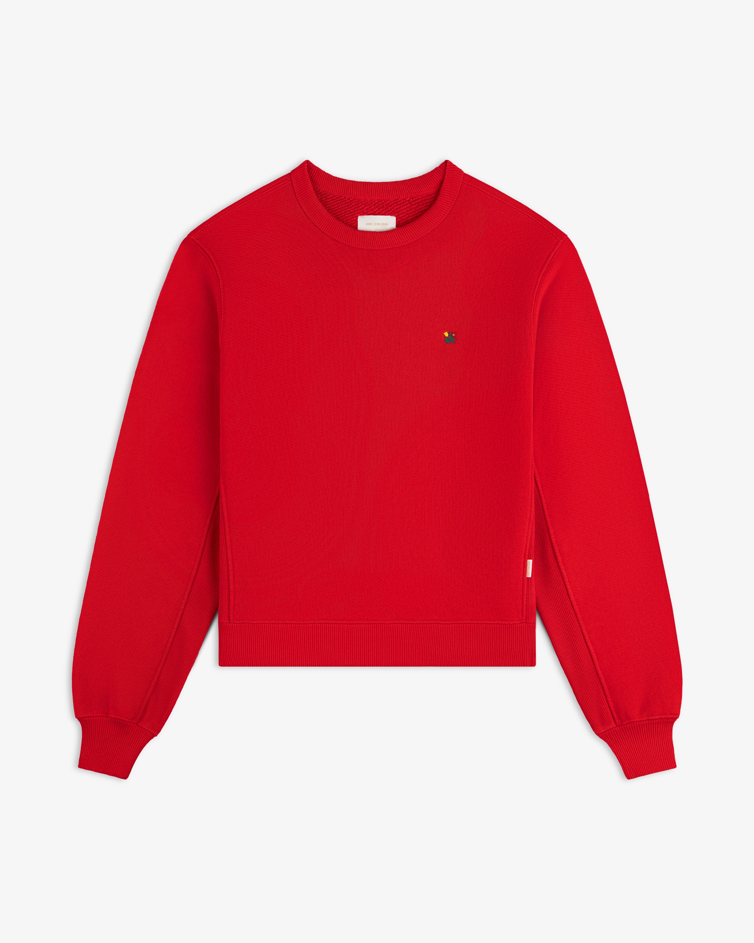 Bright red Crest Crewneck Sweatshirt with a small embroidered logo on the chest.