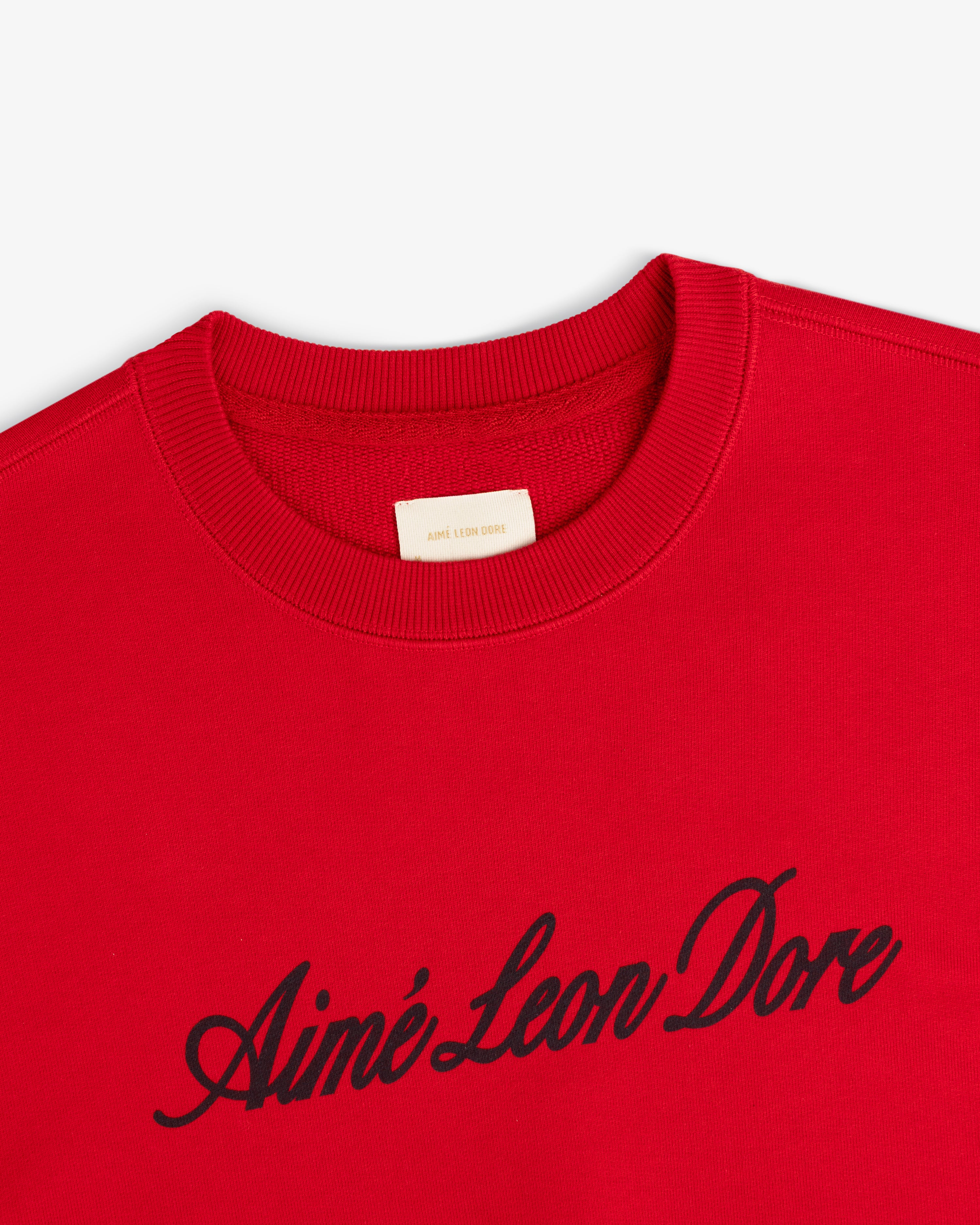 Red Vintage Script Crewneck Sweatshirt featuring Aimé Leon Dore in black script across the chest.