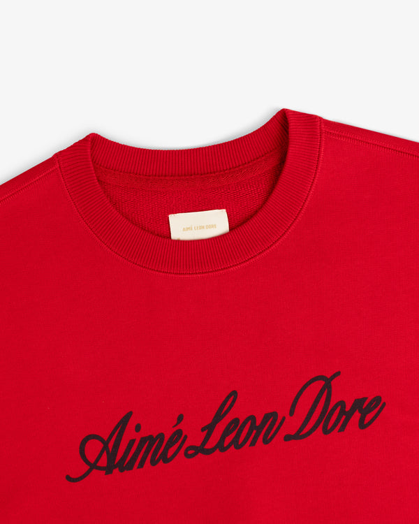 Red Vintage Script Crewneck Sweatshirt featuring Aimé Leon Dore in black script across the chest.