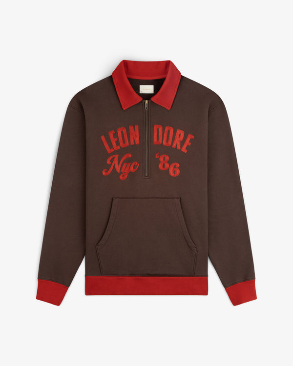 Brown Chainstitch ’86 Half Zip Pullover with red collar, cuffs, and hem, featuring red LEON DORE Nyc 86 embroidery.