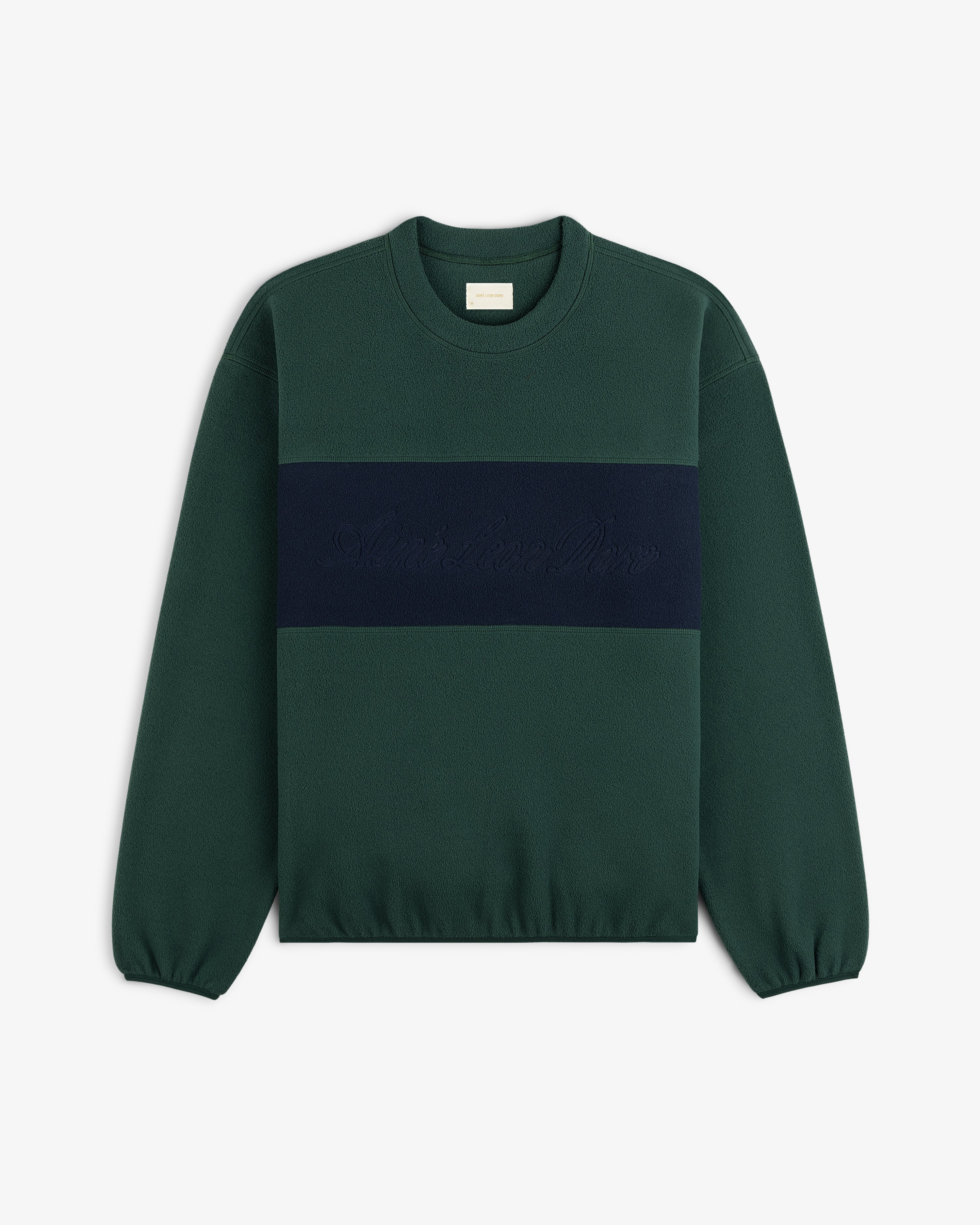 Fleece Script Paneled Crewneck Sweatshirt in dark green with a navy blue chest panel and tonal embroidered script.