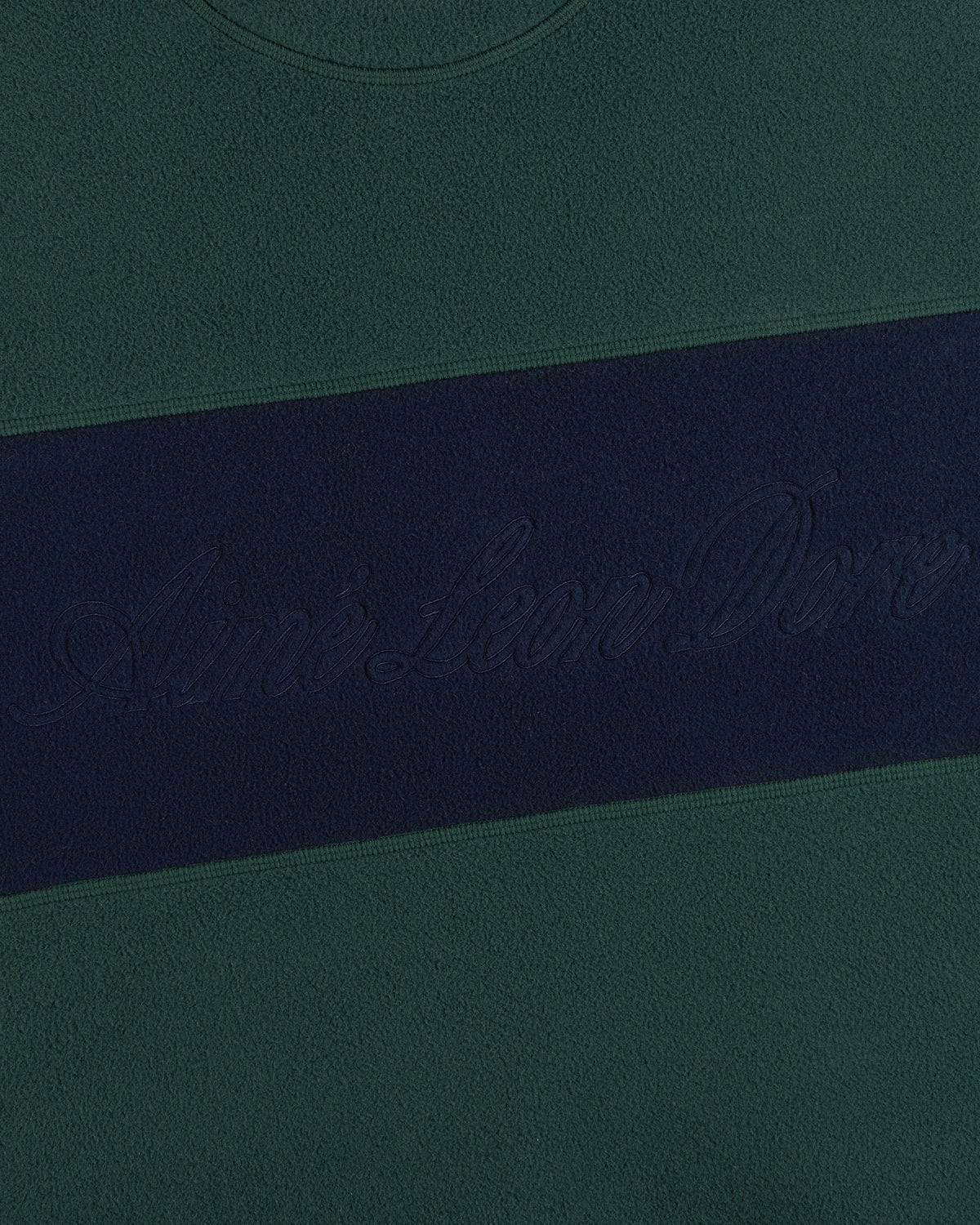 Fleece Script Paneled Crewneck Sweatshirt in dark green with a navy blue chest stripe and embroidered script text.