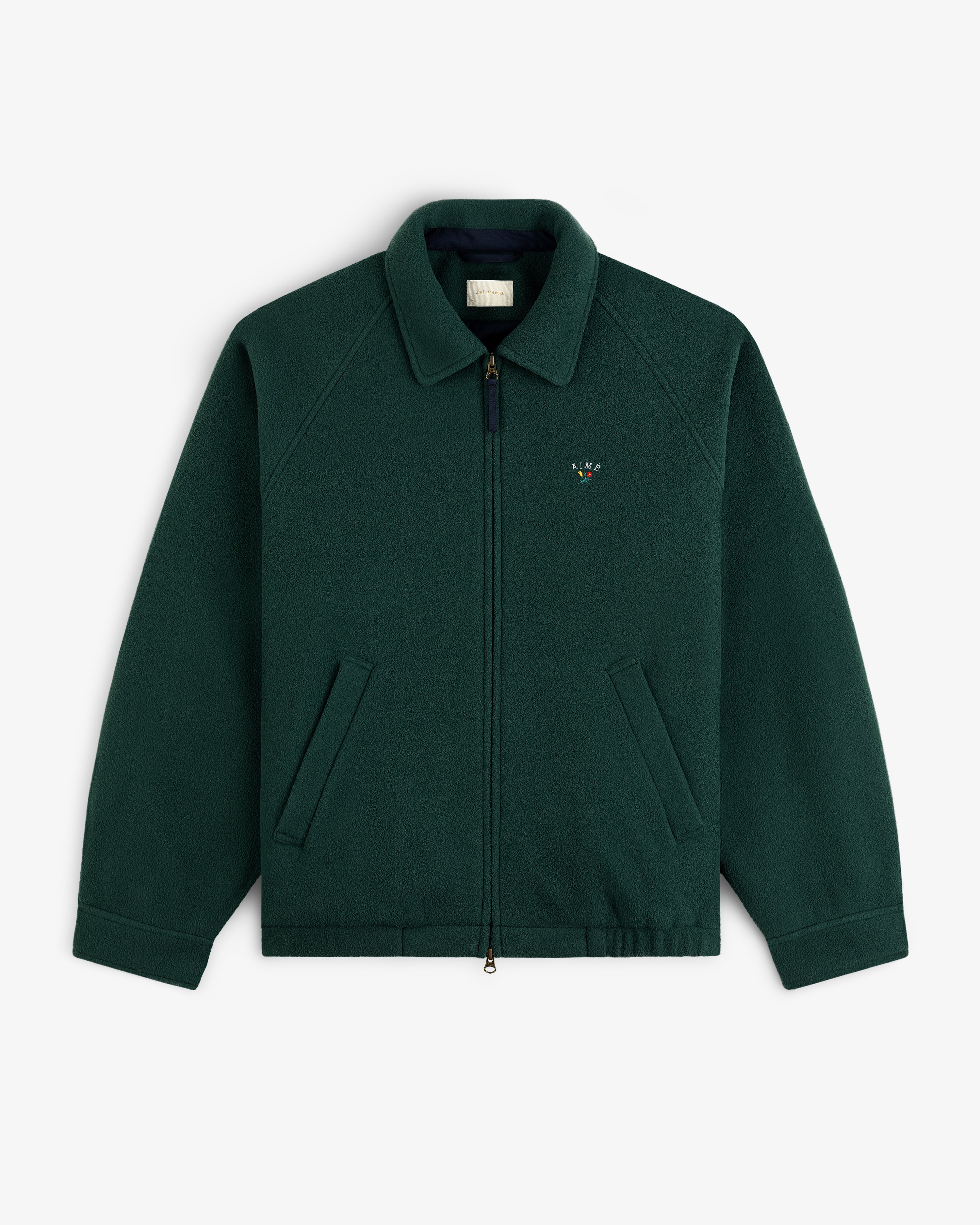 Crest Fleece Casual Jacket: dark green zip-up with collar, slant pockets, and small left-chest emblem.