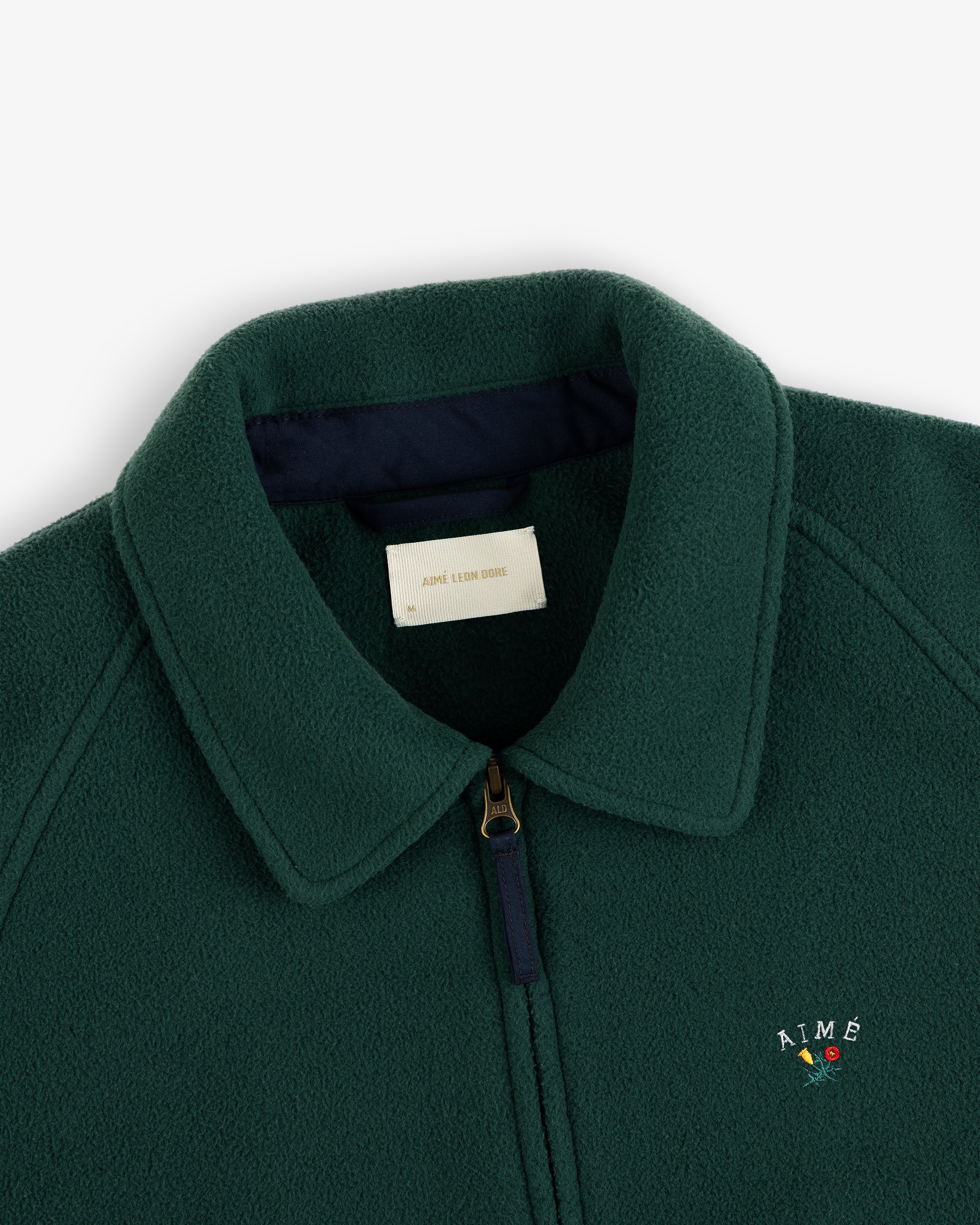 Crest Fleece Casual Jacket: green, collared, zip-up, with AIMÉ and a small flower embroidered on the chest.
