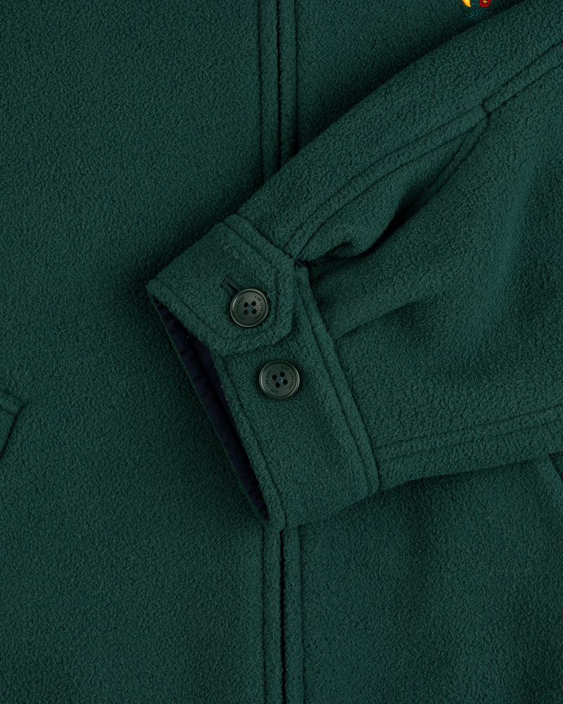 Crest Fleece Casual Jacket in dark green, featuring black buttons, visible seams, and partial pocket detail.