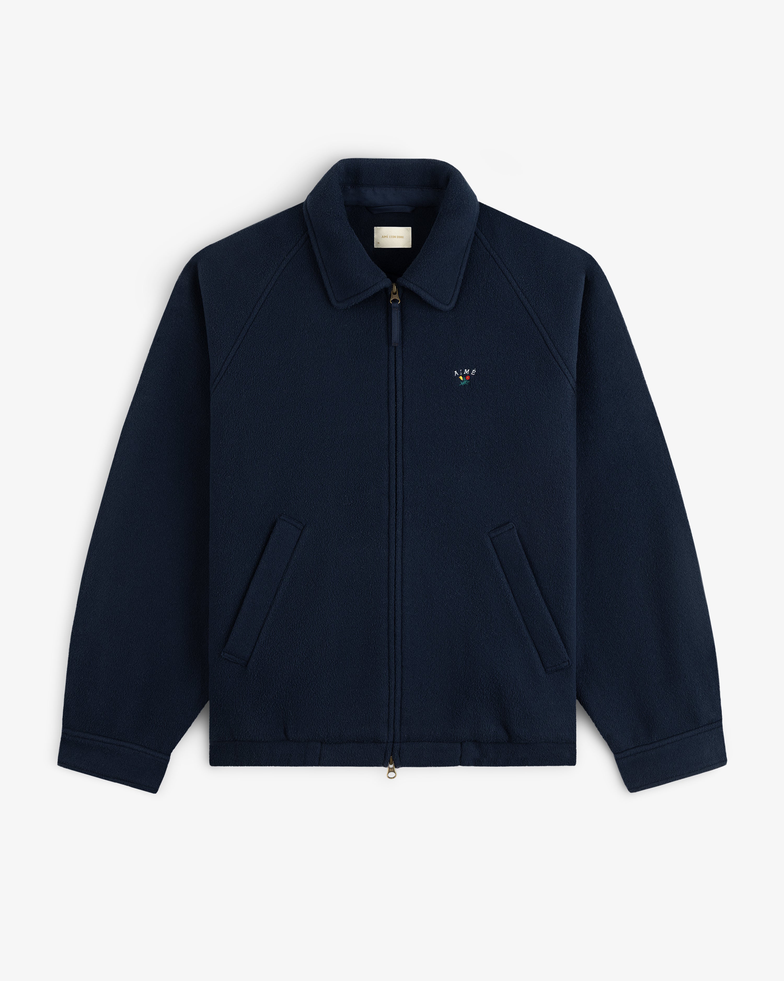 Crest Fleece Casual Jacket—navy zip-up with collar, front pockets, and small logo on the left chest.