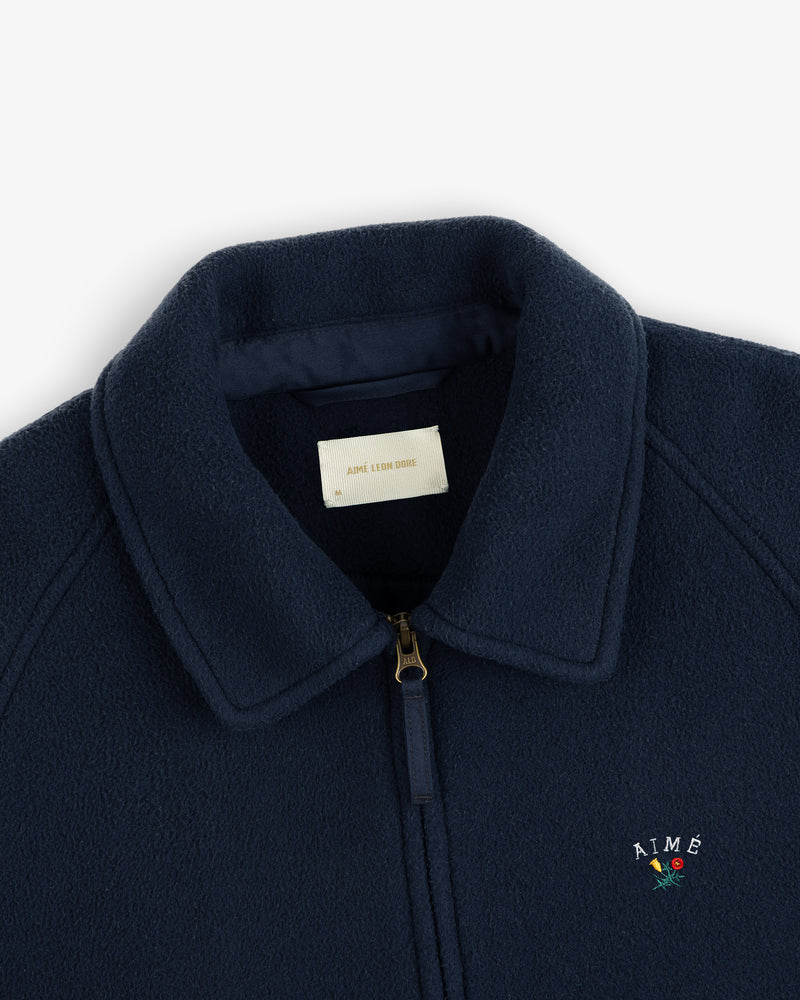 Crest Fleece Casual Jacket: Navy blue with gold zipper, collar, and AIMÉ + rose embroidery on chest.