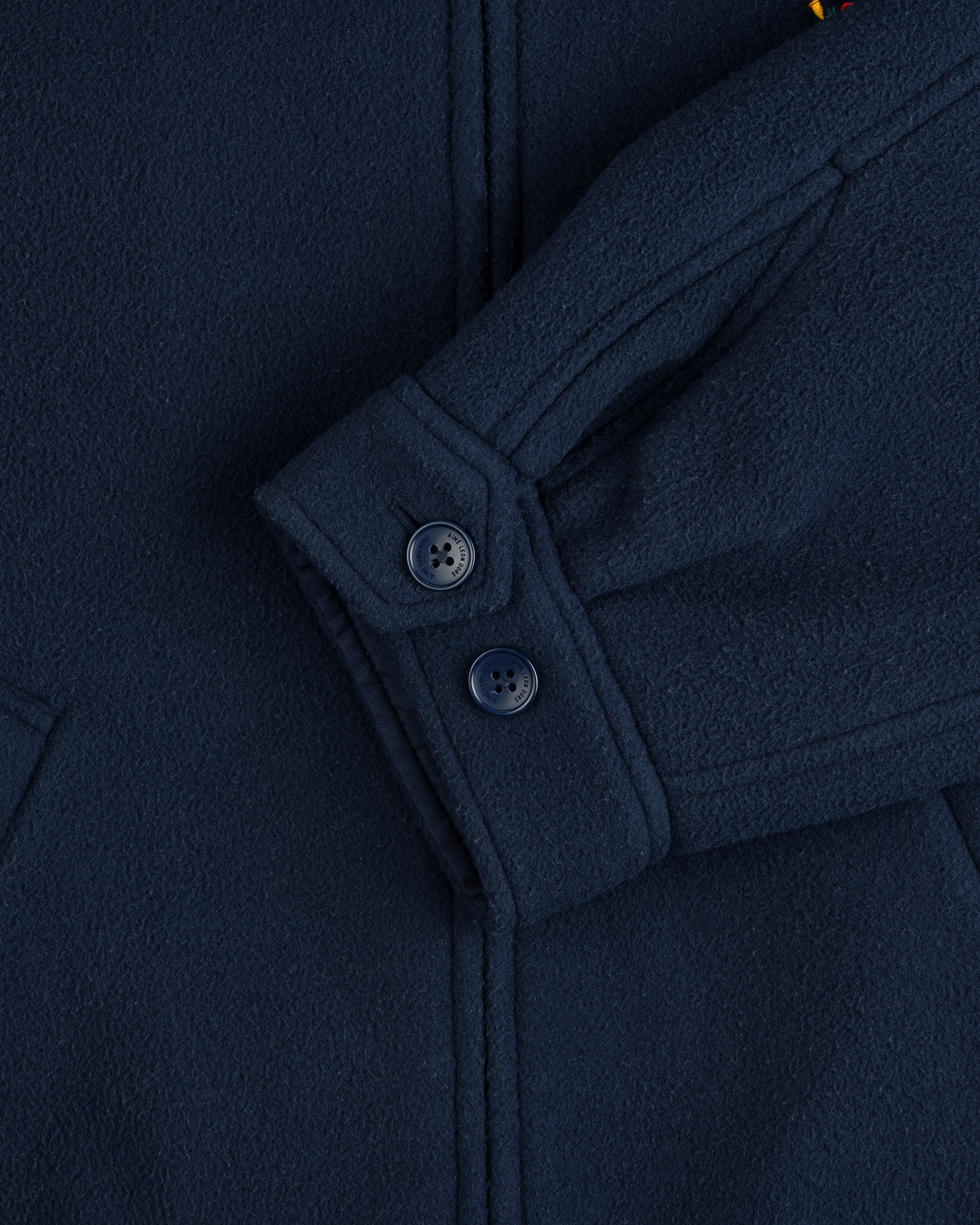 Close-up of a Crest Fleece Casual Jacket sleeve in navy with two cuff buttons and a partly visible pocket.
