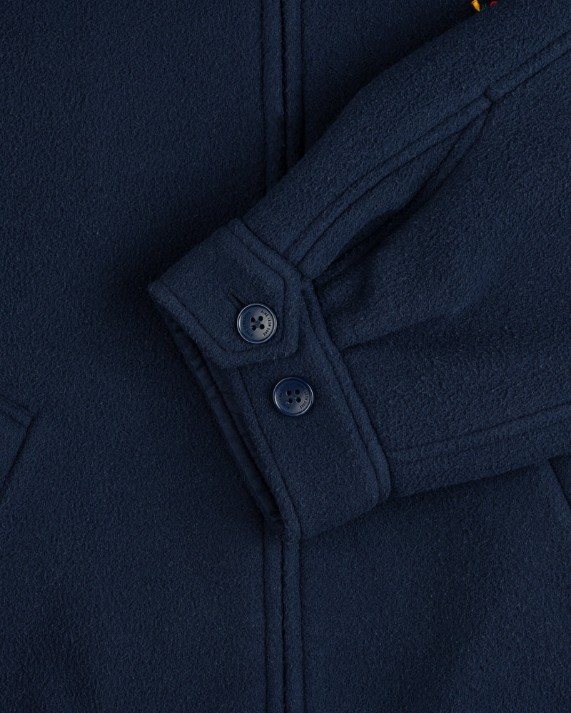 Close-up of a Crest Fleece Casual Jacket sleeve in navy with two cuff buttons and a partly visible pocket.