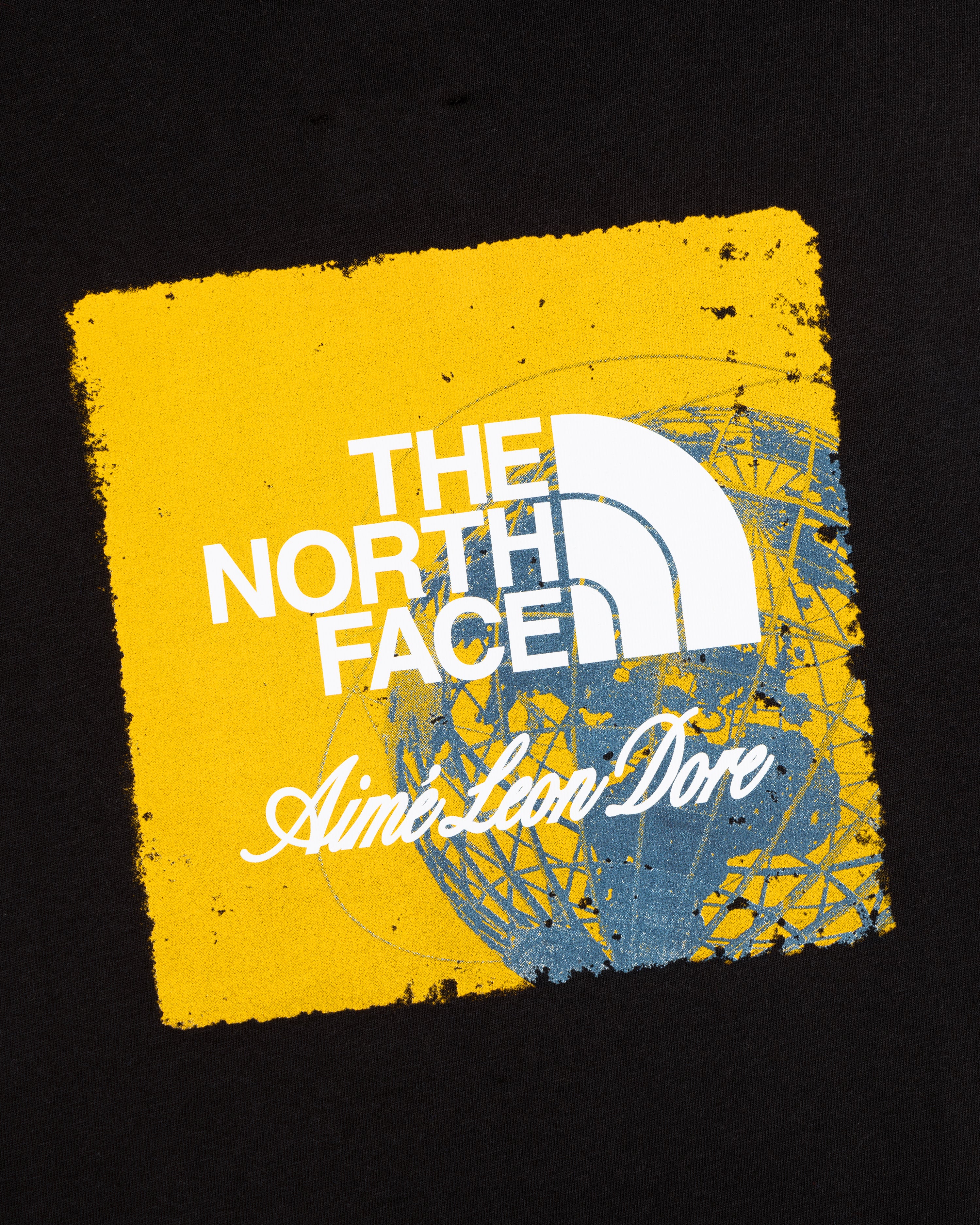 ALD / The North Face Logo Tee: Features both logos on a yellow square with a blue globe sketch, set on black.