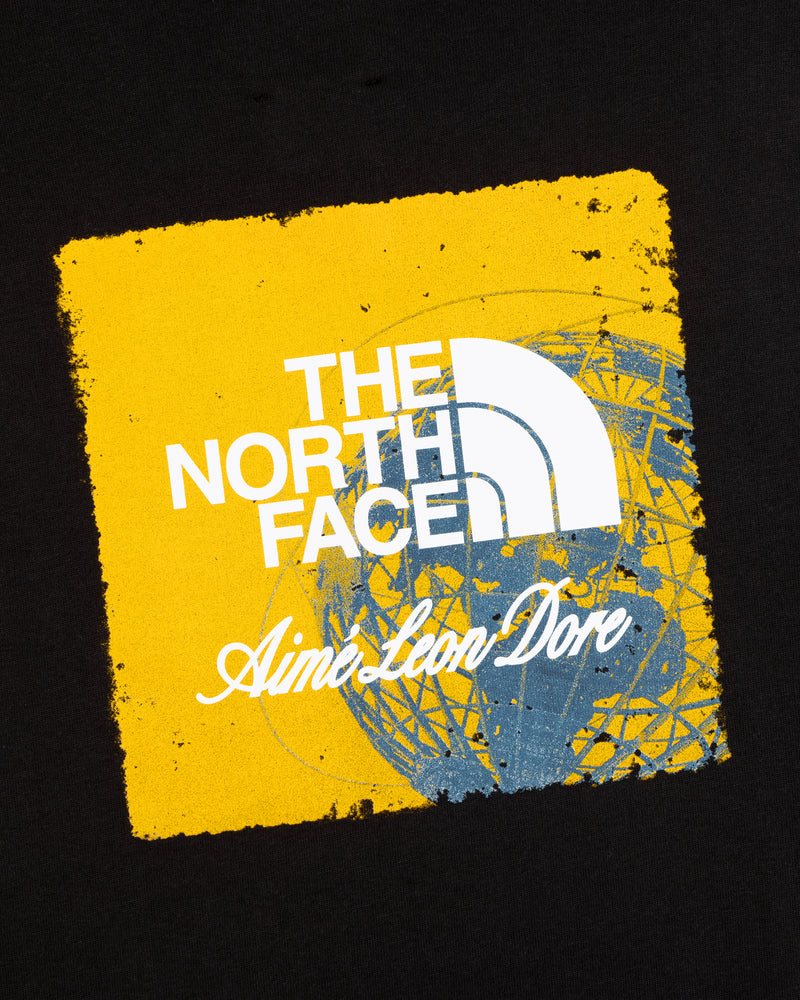 ALD / The North Face Logo Tee: Features both logos on a yellow square with a blue globe sketch, set on black.