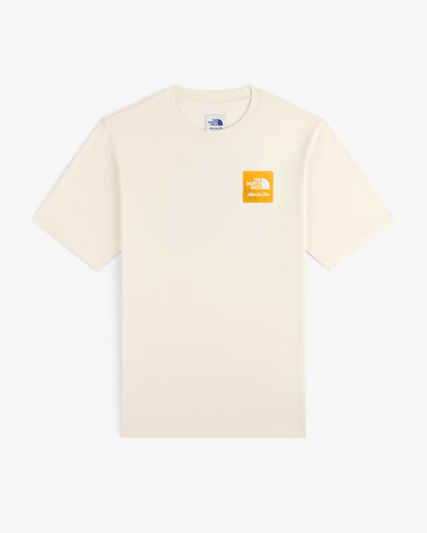 ALD/The North Face Logo Tee: off-white, short-sleeve with small yellow logo on left chest.