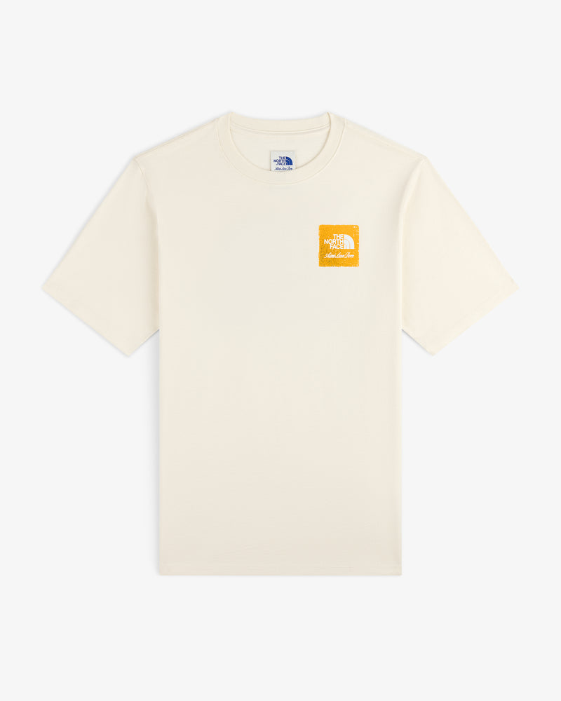 ALD/The North Face Logo Tee: off-white, short-sleeve with small yellow logo on left chest.