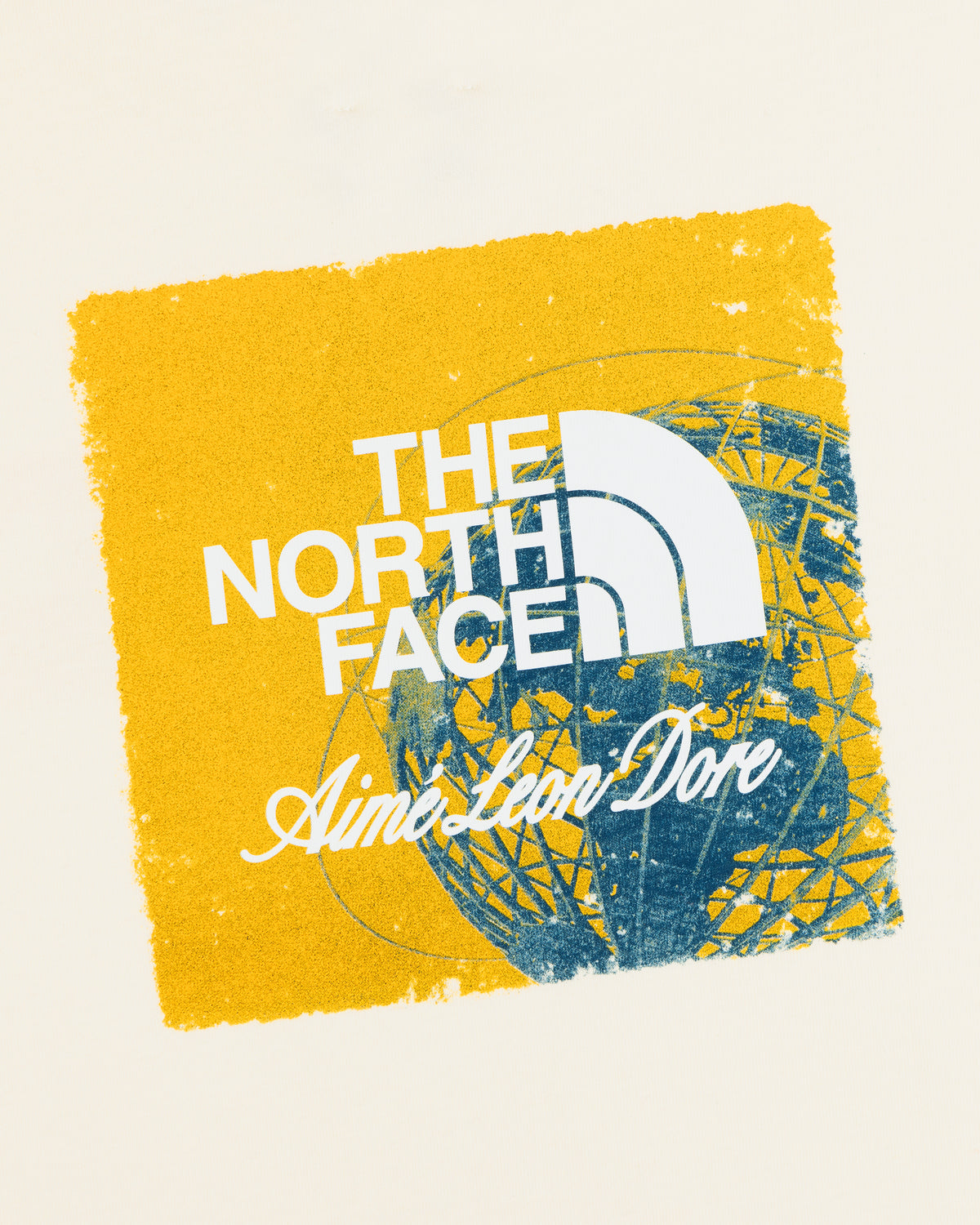 ALD / The North Face Logo Tee: Yellow square with both logos on blue geometric design, light background.