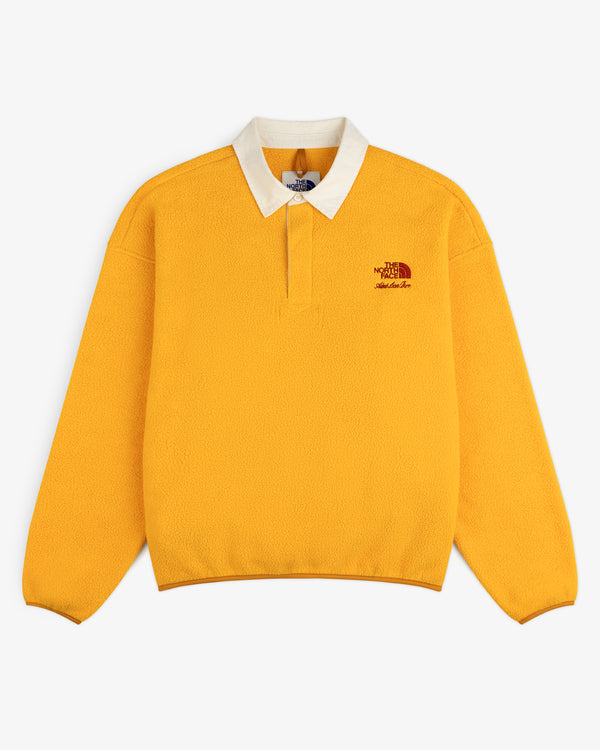 Bright yellow ALD / The North Face Fleece Rugby with white collar and embroidered logo on the left chest.