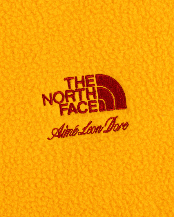 ALD / The North Face Fleece Rugby in yellow with red embroidered logos on the fabric.