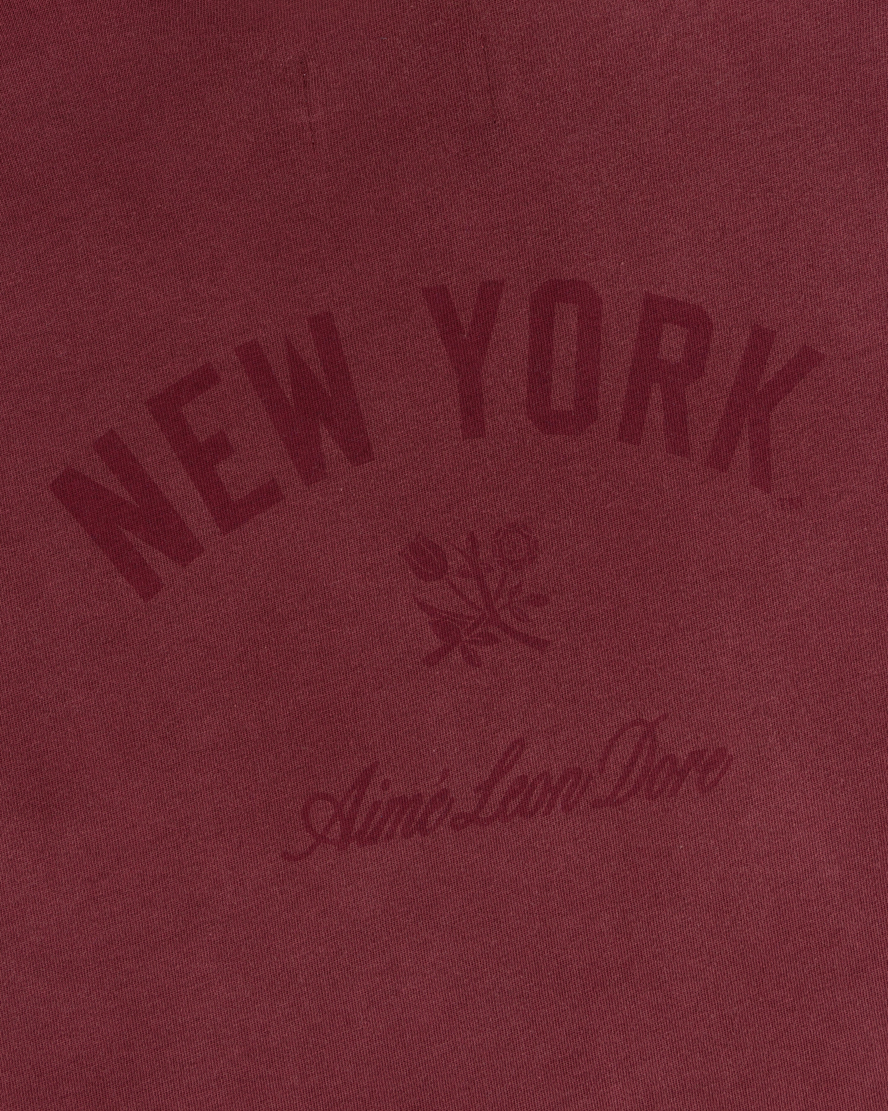 Yankees Washed Logo Tee: Maroon tee with arched NEW YORK, two roses, and Aimé Leon Dore text in matching maroon.