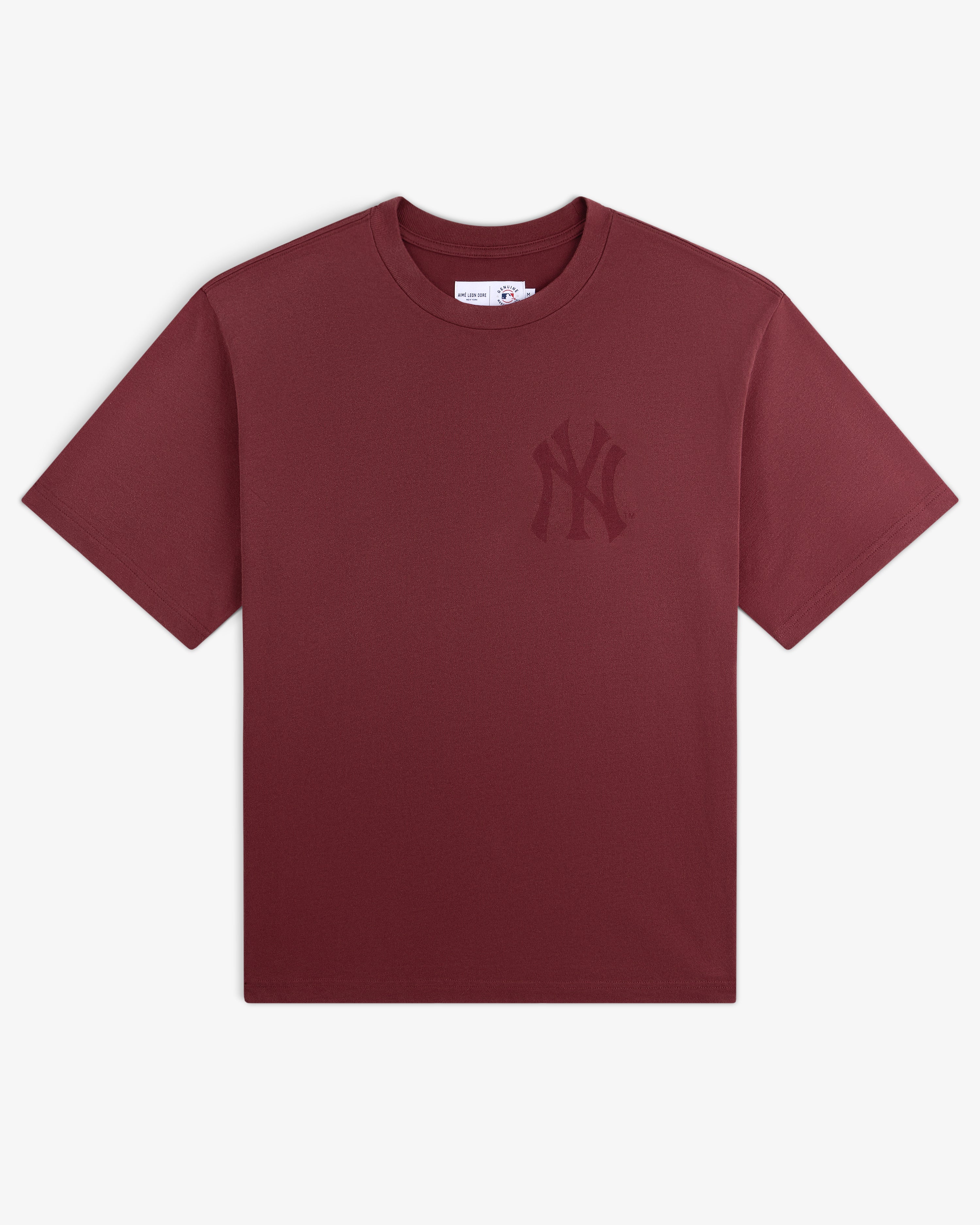 Yankees Washed Logo Tee: Maroon short-sleeve shirt featuring a subtle NY Yankees logo on the left chest.