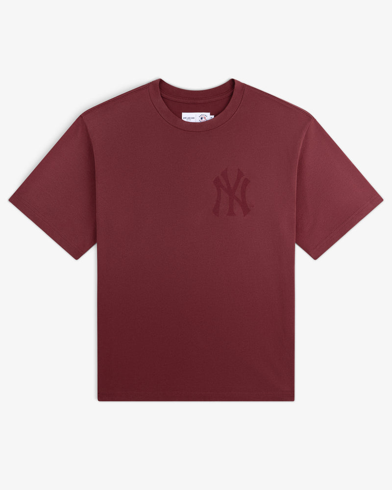 Yankees Washed Logo Tee: Maroon short-sleeve shirt featuring a subtle NY Yankees logo on the left chest.