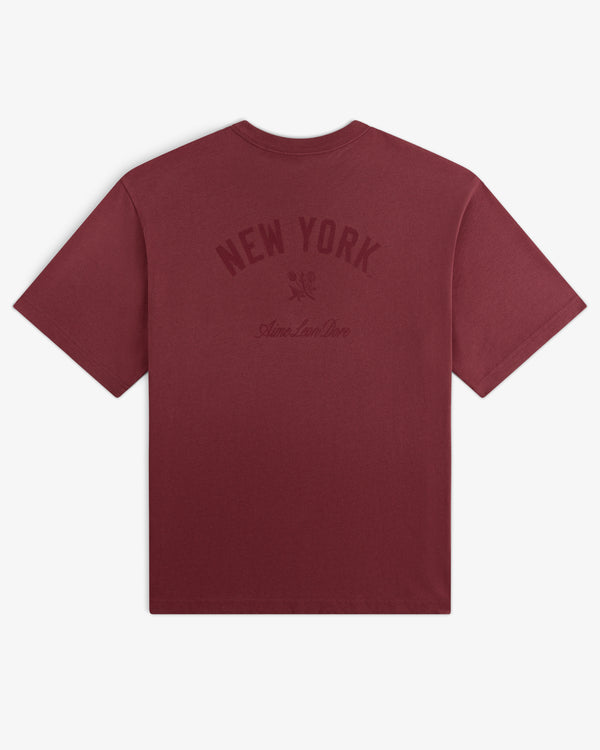 Yankees Washed Logo Tee: Maroon t-shirt with NEW YORK and Aimé Leon Dore text in dark print on back.