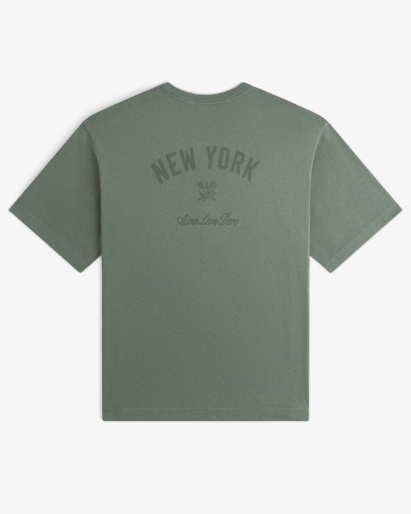 Yankees Washed Logo Tee in sage green with NEW YORK and Aime Leon Dore printed on the back in dark green.