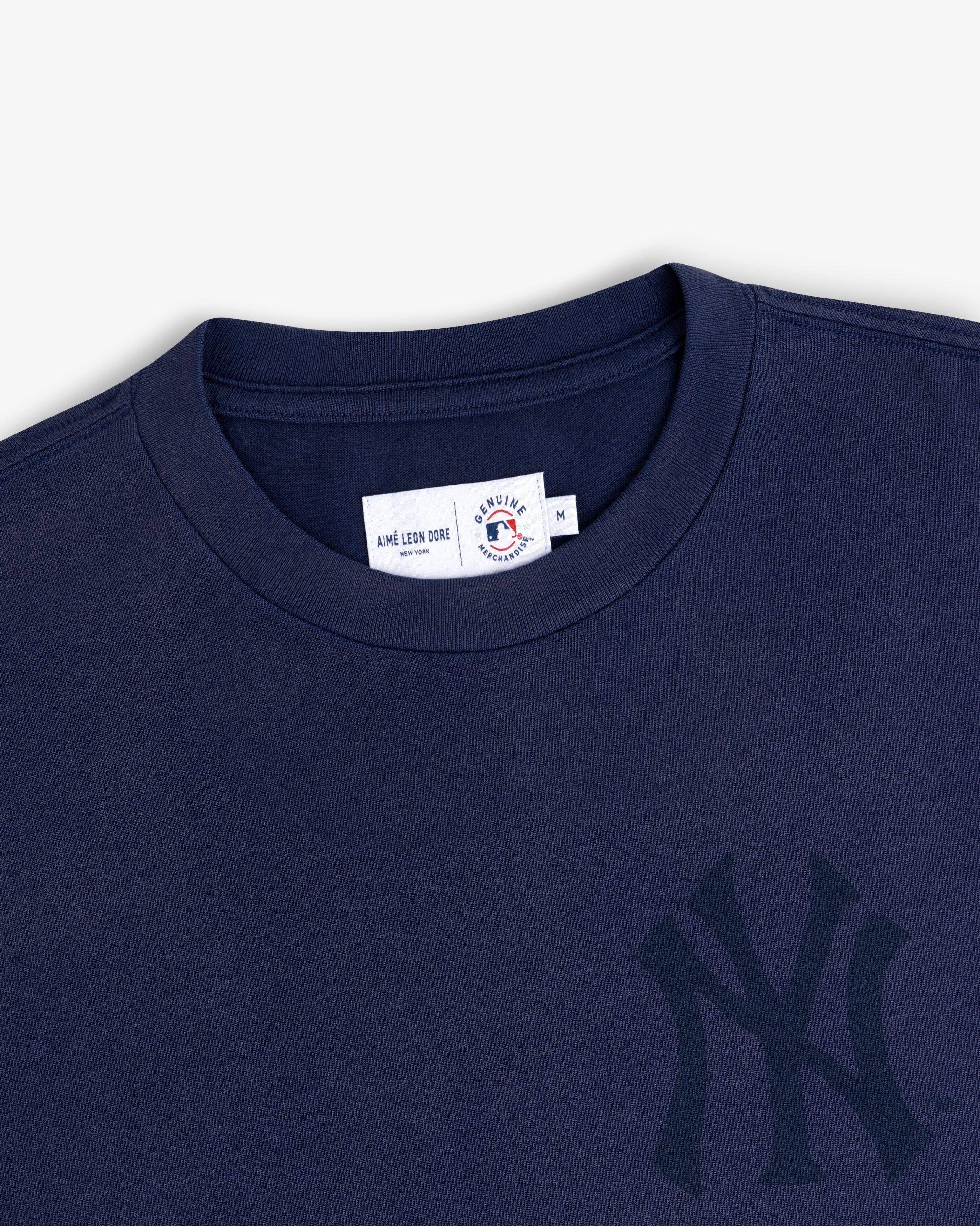 Navy Yankees Washed Logo Tee with team logo plus Aimé Leon Dore and Mitchell & Ness label.