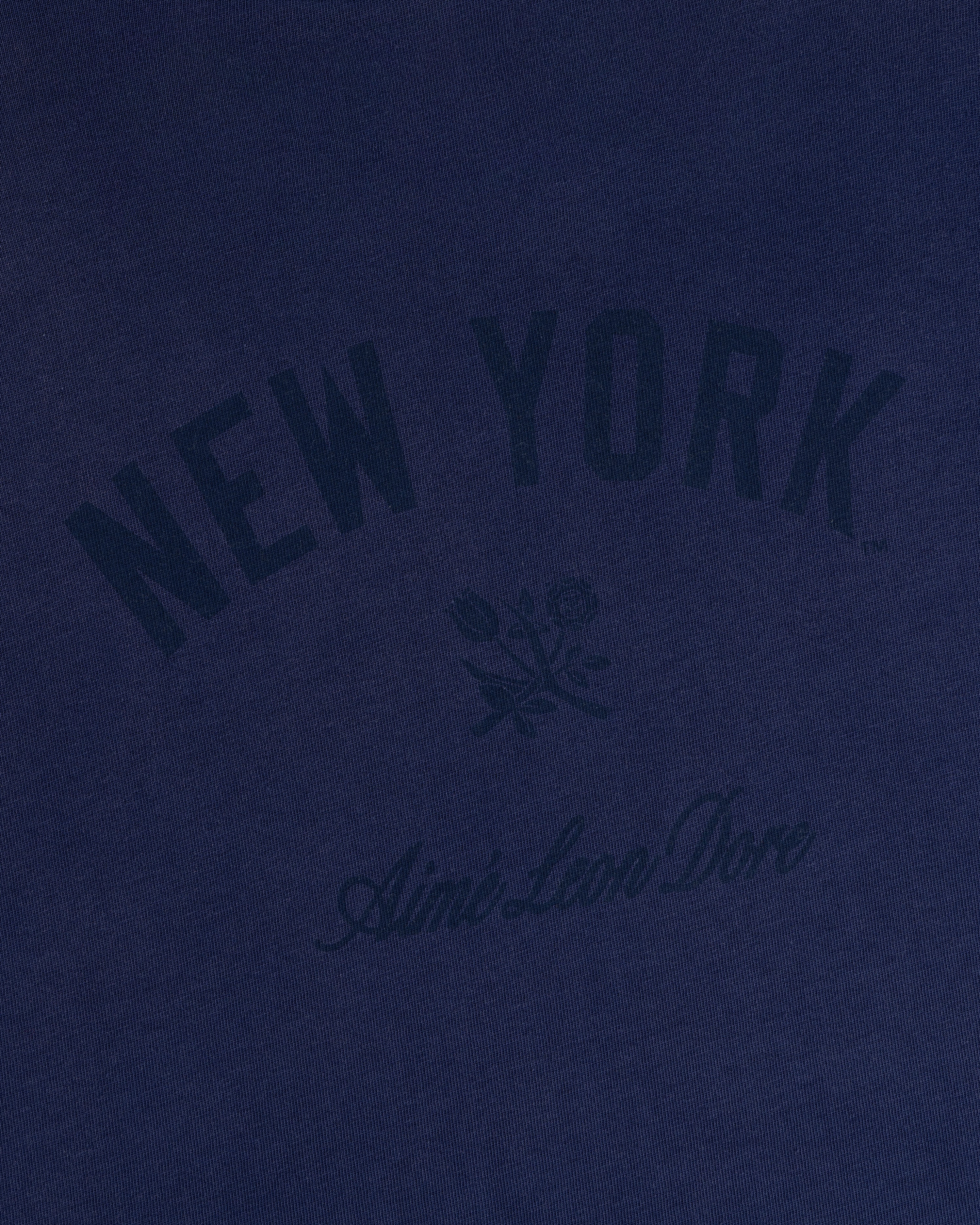 Yankees Washed Logo Tee in navy with NEW YORK, Aimé Leon Dore text, and a small dark floral graphic.