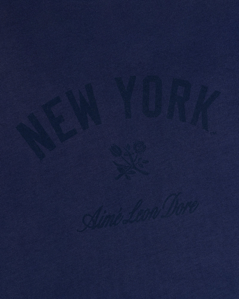 Yankees Washed Logo Tee in navy with NEW YORK, Aimé Leon Dore text, and a small dark floral graphic.