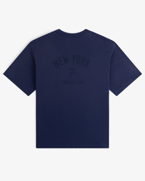 Yankees Washed Logo Tee in navy with NEW YORK and small dark text printed on the back.