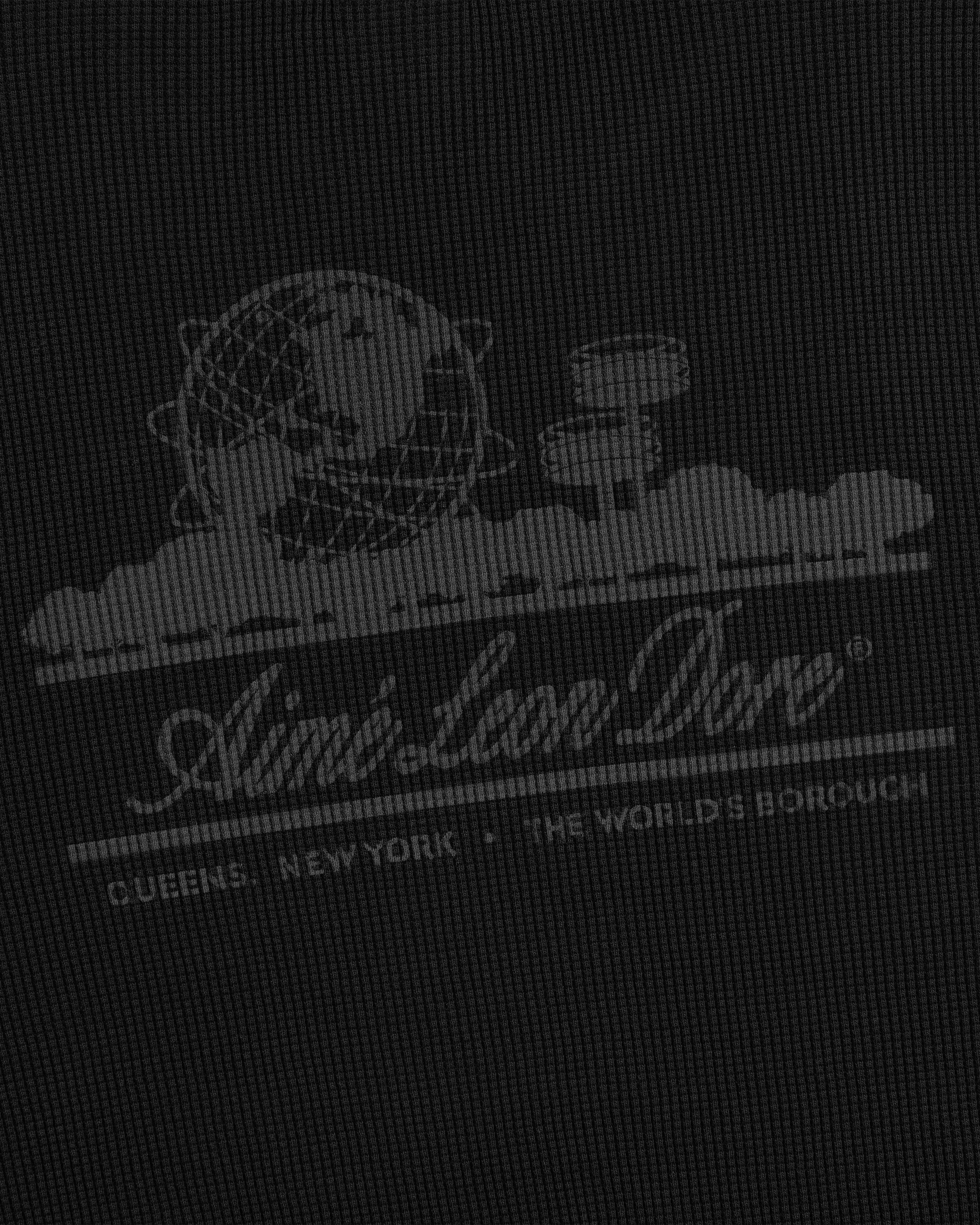 White globe and circular graphics with “Aimé Leon Dore® Queens, NY” on Long-Sleeve Unisphere Waffle Thermal.