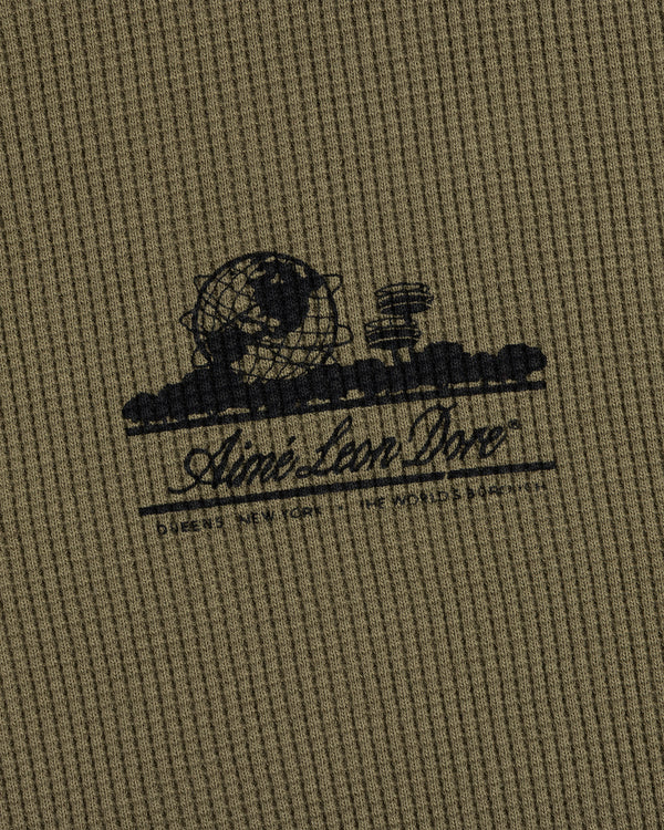 Olive Long-Sleeve Unisphere Waffle Thermal with a black globe, landscape print, and Ainé bon Doré cursive text.