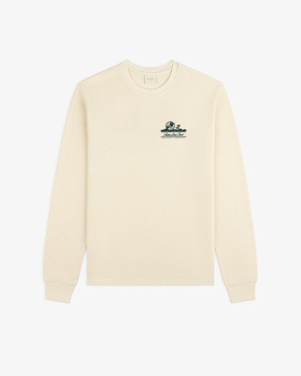 Cream Unisphere Waffle Thermal, long sleeves, ribbed texture, small green logo embroidered on left chest.