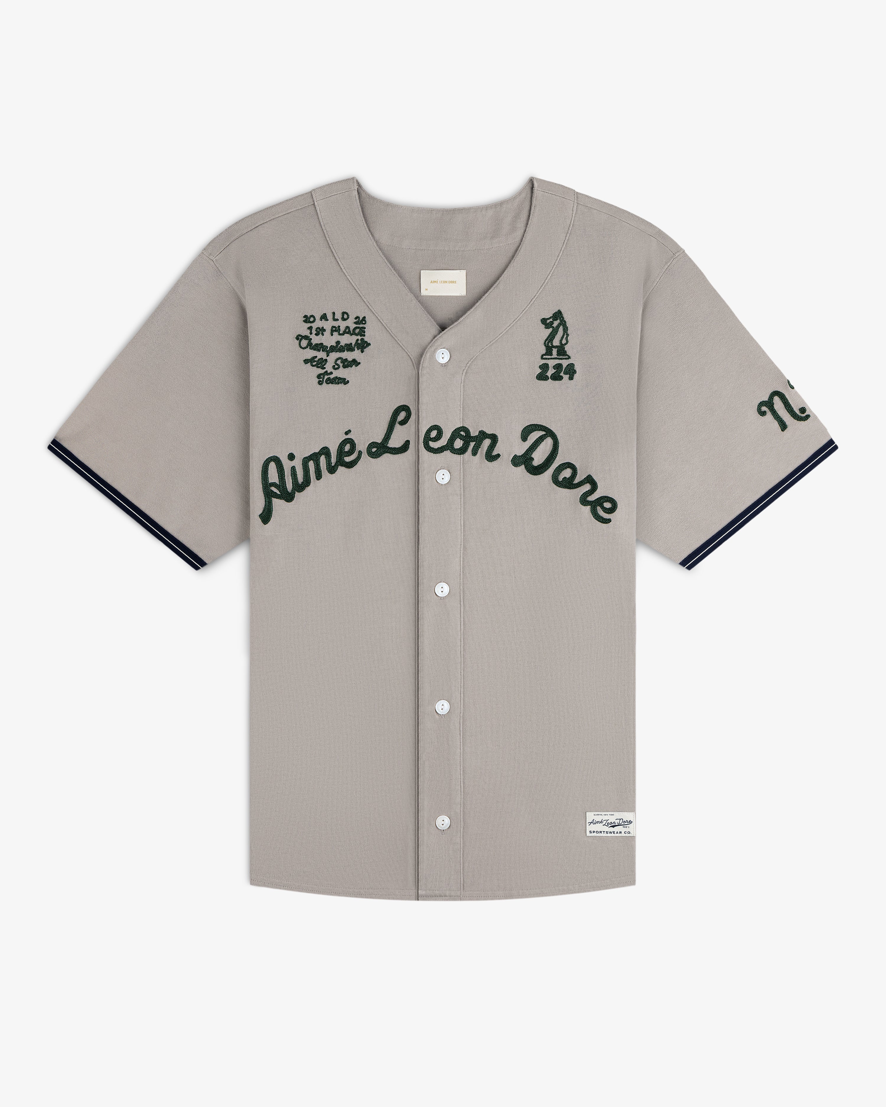 Mulberry Chainstitch Baseball Jersey with Aimé Leon Dore script, front buttons, and patches, in gray.
